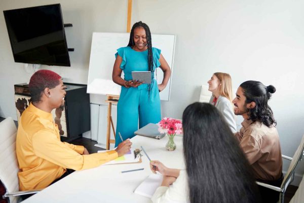 A person confidently leading a meeting, showing the transformation from shame to empowerment