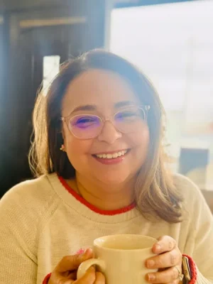 Nova Bickers holding a cup