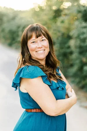 Helene Tisdale in blue dress